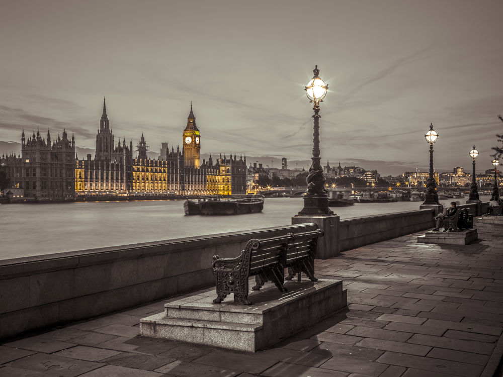 Benchs by the walkway next to river thames, London, Uk
