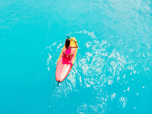 Sup surfing in tropical sea