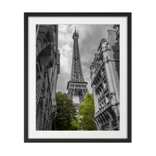 View of Eiffel Tower from a narrow street in Paris, France