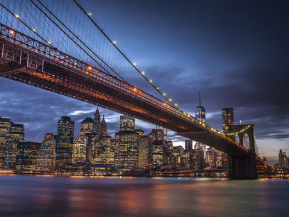 Brooklyn Bridge and lower Manhattan skyline at dusk, New York