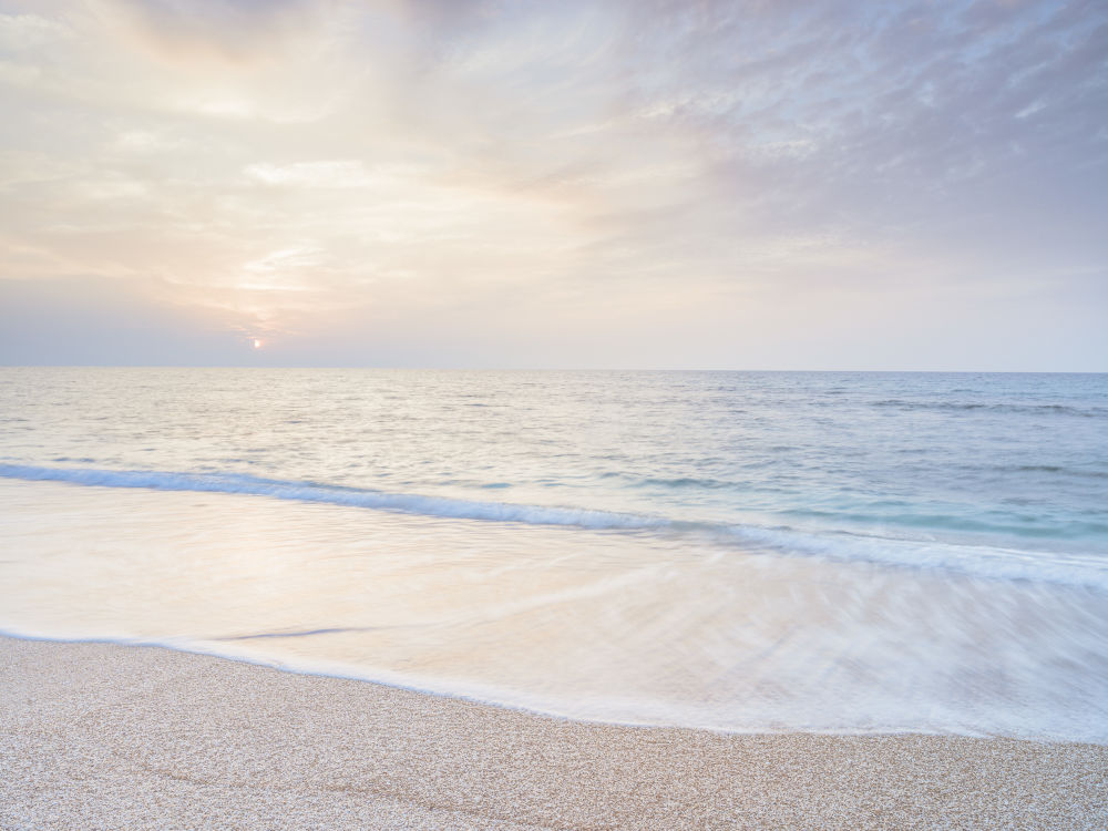 Calm beach at sunset