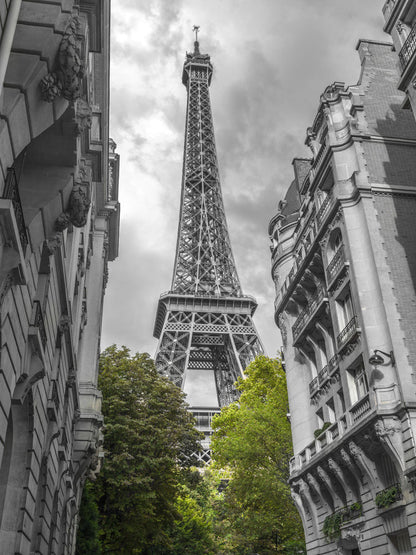 View of Eiffel Tower from a narrow street in Paris, France